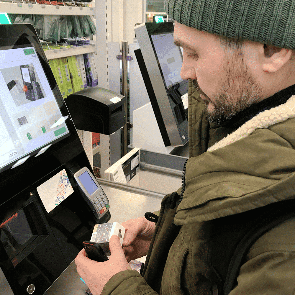 Man at smart check out